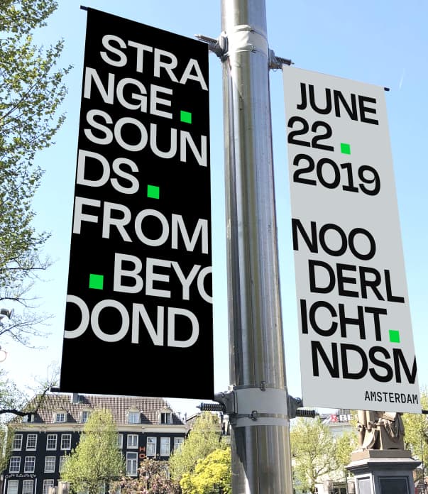 Street banners reading Strange Sounds From Beyond and June 22 2019